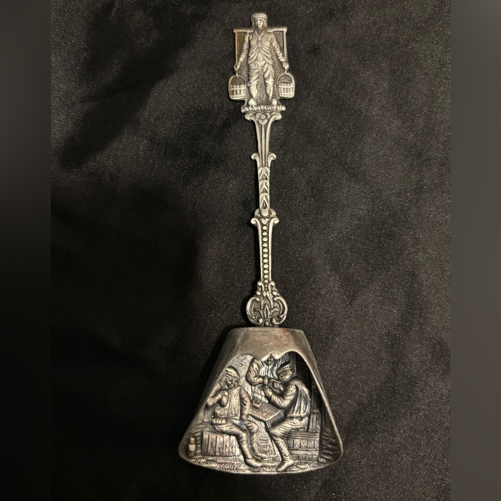 Ornate Silver Spoon with Intricate Design
